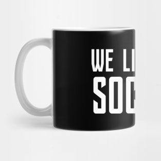 We Live In A Society Mug